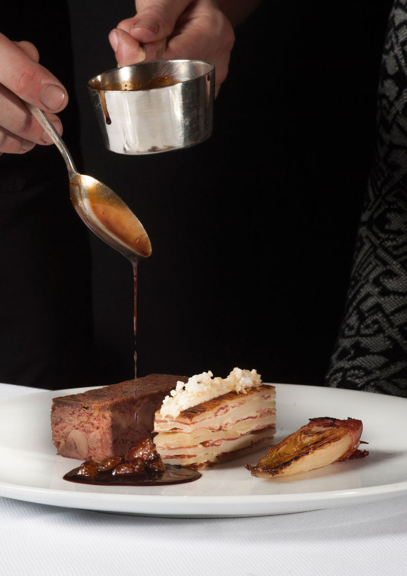 Confit de canard met witlof en sinaasappel